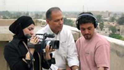 Kasim Abid trains young Iraqi filmmakers on the roof of the IFTVC building in Baghdad in 2005.