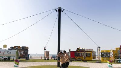 The running track has a soft surface and distance markers.