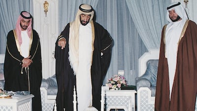 Sheikh Zayed (centre) inspecting the plan of the Sheikh Zayed Mosque with his sons Sheikh Hamdan (left) and Sheikh Sultan (right). Courtesy Al Ittihad.
