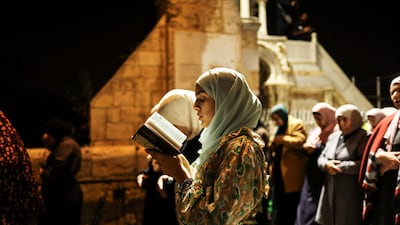 Palestinians pray. Reuters