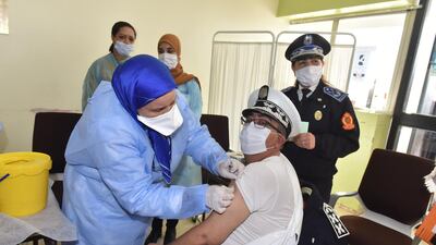 A nurse vaccinates a police officer against the coronavirus in Sale, Morocco. EPA