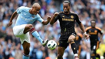 Vincent Kompany’s commanding performance against Chelsea’s Didier Drogba, right, on Saturday saw the Ivorian front man cut a frustrated figure before being substituted after 75 minutes. The Belgian defender has been a mainstay in an ever-changing back four at City this season. Jon Super / AP
