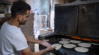 A baker at the Al Mgharblin food market in Cairo. Annual inflation in Egypt hit 38 per cent in September, marking the fourth consecutive month of record-high inflation numbers. Bloomberg