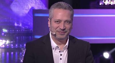 Tamer Amin pictured presenting a talk show in Egypt