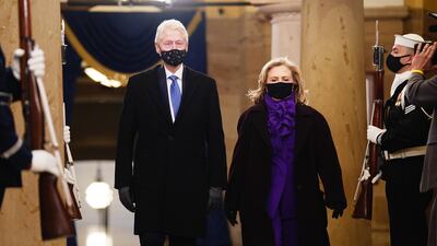 Hillary Clinton wore a deep-purple trouser suit by American label Ralph Lauren. EPA