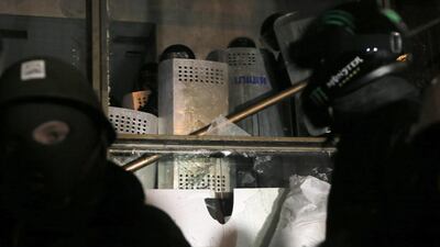 The overnight clashes at the Ukrainian House came after opposition leaders vowed to keep up protests despite an offer of concessions by President Viktor Yanukovych to end the crisis. Efrem Lukatsky / AP Photo