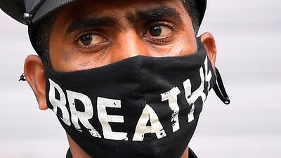 A security guard wearing a facemask as a preventive measure against the Covid-19 coronavirus is pictured in Mumbai. India's coronavirus cases surged past seven million on October 11, taking it ever closer to overtaking the United States as the world's most infected country. AFP