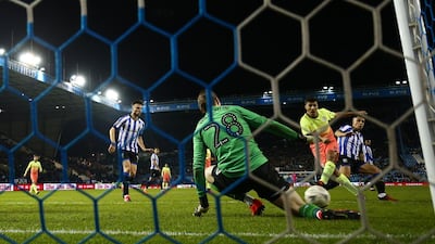 Joe Wildsmith saves from Rodrigo of Manchester City. Getty