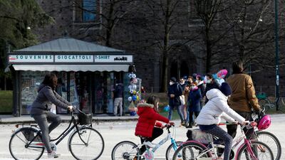 People go about their daily life in the centre of Milan during the second wave of the Covid-19 pandemic in Italy. EPA
