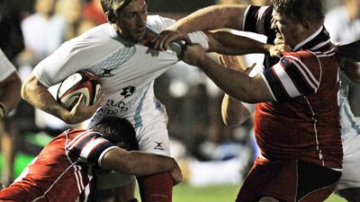 UAE rugby captain Adam Telford, pictured in action against Lloyds RFC, believes the national team has made great strides. Jeff Topping / The National
