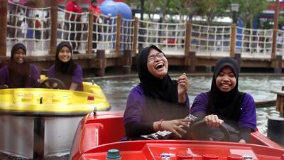 Girls ride in Lego-themed boats of Legoland Malaysia. Groundwork has started on a similar park in Dubai, which is expected to open by 2016. Rahman Roslan / Bloomberg News