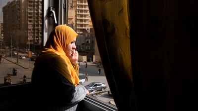 Samia Hassan, 38, from South Sinai, looks through her room's window, in Giza, Egypt, January 29, 2023. Nahr el-Hub was set up by three female Egyptian retirees, to offer housing and support for cancer patients who are not residents of Cairo and were forced to come to the capital for treatment at the hospital. REUTERS / Fatma Fahmy
