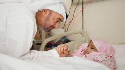 Sheikh Mohammed bin Zayed visits cancer patient, Safya bint Mohamed Al Katheri, at Sheikh Khalifa Medical City. (Ryan Carter / Crown Prince Court - Abu Dhabi )