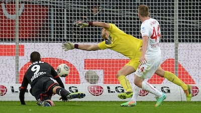 Eren Derdiyok, left, puts the ball on net for Bayer Leverkusen on Saturday. Patrik Stollarz / AFP