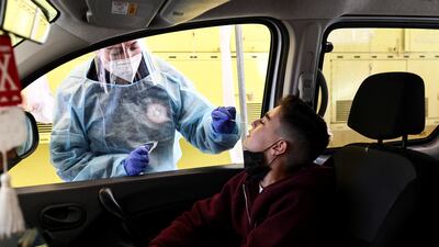 A boy is tested for Covid-19 at a drive-through site in Jerusalem. Reuters