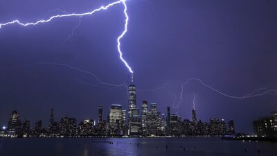 Lightning strikes One World Trade Centre in New York City during a thunderstorm as seen from Jersey City, New Jersey. Getty Images