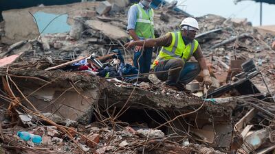 Rescue workers search for survivors in the rubble of a collapsed five-storey apartment building in Mahad, about 170 kilometres south of India's financial capital of Mumbai. AFP