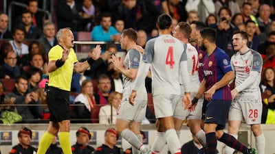 Referee Bjorn Kuipers speaks with Liverpool's James Milner. Action Images via Reuters