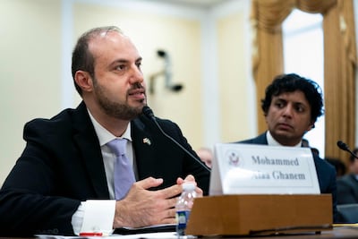 Mohammed Alaa Ghanem speaks alongside M Night Shyamalan during a congressional hearing in Washington. Getty Images / AFP