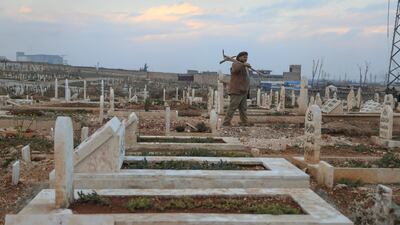 Idlib’s tombstones stretch as far as the eye can see, bathed in a soft orange light as the sun sets on the horizon.