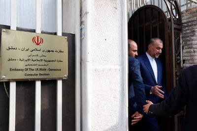 Iranian Foreign Minister Hossein Amirabdollahian, right, leaves after the opening of the new Iranian consulate building in Damascus on April 8. AP