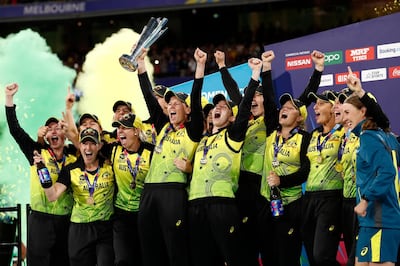 Meg Lanning of Australia holds aloft the trophy and celebrates with teammates after the ICC Women's T20 World Cup Final match against India at the MCG in 2020. Getty Images