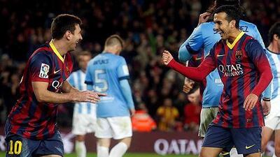 Barcelona's Lionel Messi, left, rejoices on teammate Pedro Rodriguez's goal against Malaga during their Primera League match at Camp Nou stadium. Albert Gea / Reuters