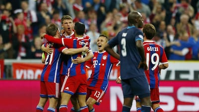 Bayern Munich’s Thomas Muller celebrates scoring their fourth goal with teammates on Tuesday. Reuters / Michaela Rehle