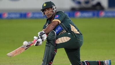 Pakistani batsman Sarfraz Ahmed plays a six during the first International T20 cricket match at Dubai International Stadium in Dubai on December 4, 2014. Pakistan captain Shahid Afridi won the toss and put New Zealand into bat in the first of two Twenty20 internationals in Dubai. AFP PHOTO