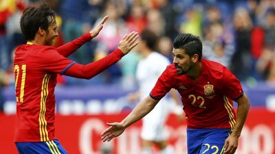 Nolito, right, celebrates with Spain teammate David Silva after scoring against South Korea. Leonhard Foeger / Reuters