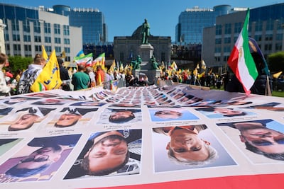 Activists protest against the execution of political prisoners in Iran, outside the European Parliament in Brussels. EPA