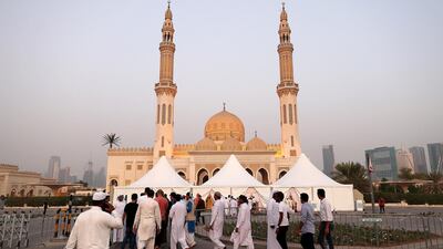 People head to Zabeel Mosque for Eid Al Adha prayers. Pawan Singh / The National