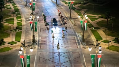 Mounted cavalry riders escort the motorcade of Prince Mohamed bin Salman upon his arrival at Qasr Al Watan.