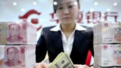 More global businesses are settling their debts in the yuan and offshore funds are investing in it but analysts say the US dollar will remain the first-choice global currency for some time.