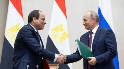 Russian President Vladimir Putin and Egyptian President Abdel Fattah el Sisi shake hands during a signing ceremony following their meeting in the Black Sea resort of Sochi. Reuters