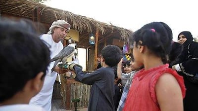 Multicultural Abu Dhabi: Abdullah Mian Sodagar shows off one of his falcons at the Qasr Al Hosn Festival. Sammy Dallal / The National