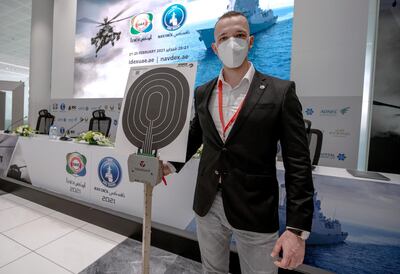 Robert Schochmann, chief executive of Trainshot, with the target practice robot at Idex. Victor Besa / The National