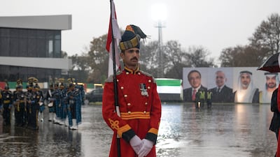 Sheikh Khaled receives a military guard of honour after landing at Nur Khan Air Base