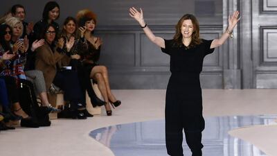 British-born fashion designer Clare Waight Keller acknowledges applause at the end of the presentation of Chloé’s autumn/winter 2017-2018 ready-to-wear collection. Francois Mori / AP Photo