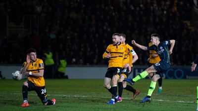 Manchester City midfielder Phil Foden, right, was on target twice in the 4-1 win over League Two Newport County to clinch City's place in the quarter-finals of the FA Cup. EPA