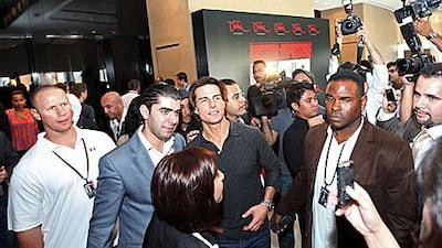 Tom Cruise and other actors and executives discuss the filming of Mission: Impossible Ghost Protocol while making a stop at the Armani Hotel in Dubai yesterday.