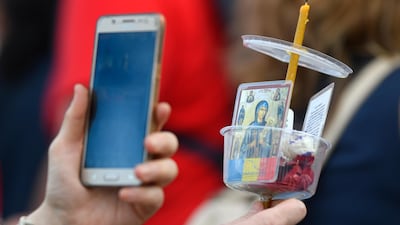 A new study suggests the coronavirus can survive up to 28 days on the surface of a mobile phone. AP