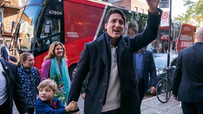 Canadian Prime Minister and Liberal leader Justin Trudeau arrives at the polling station with his son Hadrian, his wife Sophie and daughter Ella-Grace in Montreal, Monday, Oct. 21, 2019. AP