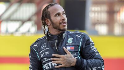 Mercedes driver Lewis Hamilton of Britain celebrates after winning the Formula One Grand Prix of Tuscany, at the Mugello circuit in Scarperia, Italy, Sunday, Sept. 13, 2020. (AP Photo/Luca Bruno, Pool)