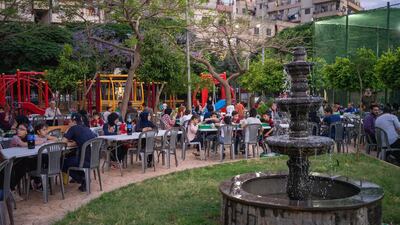 People gather to share iftar in a community garden in one of Tripoli's most deprived neighbourhoods during Ramadan