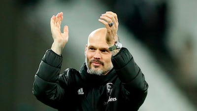 Arsenal's Swedish Interim head coach Freddie Ljungberg applauds the fans at The London Stadium following his side's 3-1 Premier League win. AFP