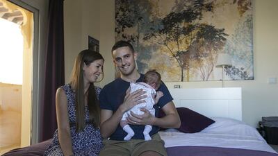 Readers say that Jo and Nathan Sadler have done the right thing by moving from a villa into a small apartment so they can save money to buy their own house. Mona Al Marzooqi / The National