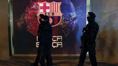 Catalan police officers patrol outside the Camp Nou stadium before Tuesday night’s Champions League match between Barcelona and AS Roma. Pau Barrena / AFP