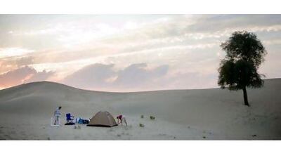 A family sets up camp. "The desert is so quiet and you really feel isolated from the city," says Riyaz Abdul, a regular camper.