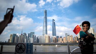 S&P cut China's sovereign rating by one step, to A+ from AA-. JOHANNES EISELE/AFP